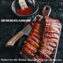 Load image into Gallery viewer, Grilled pork ribs with Spicy Plum hot sauce and dipping bowl on wooden board. BBQ meat with rich glaze and award-winning New Zealand sauce.