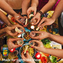 Load image into Gallery viewer, Backyard Mexican party with hands toasting tequila shots – Gringa’s Green K-Pow bottle bottom left